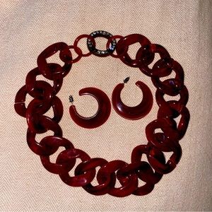 Plastic chain style necklace with matching earrings. Deep red.